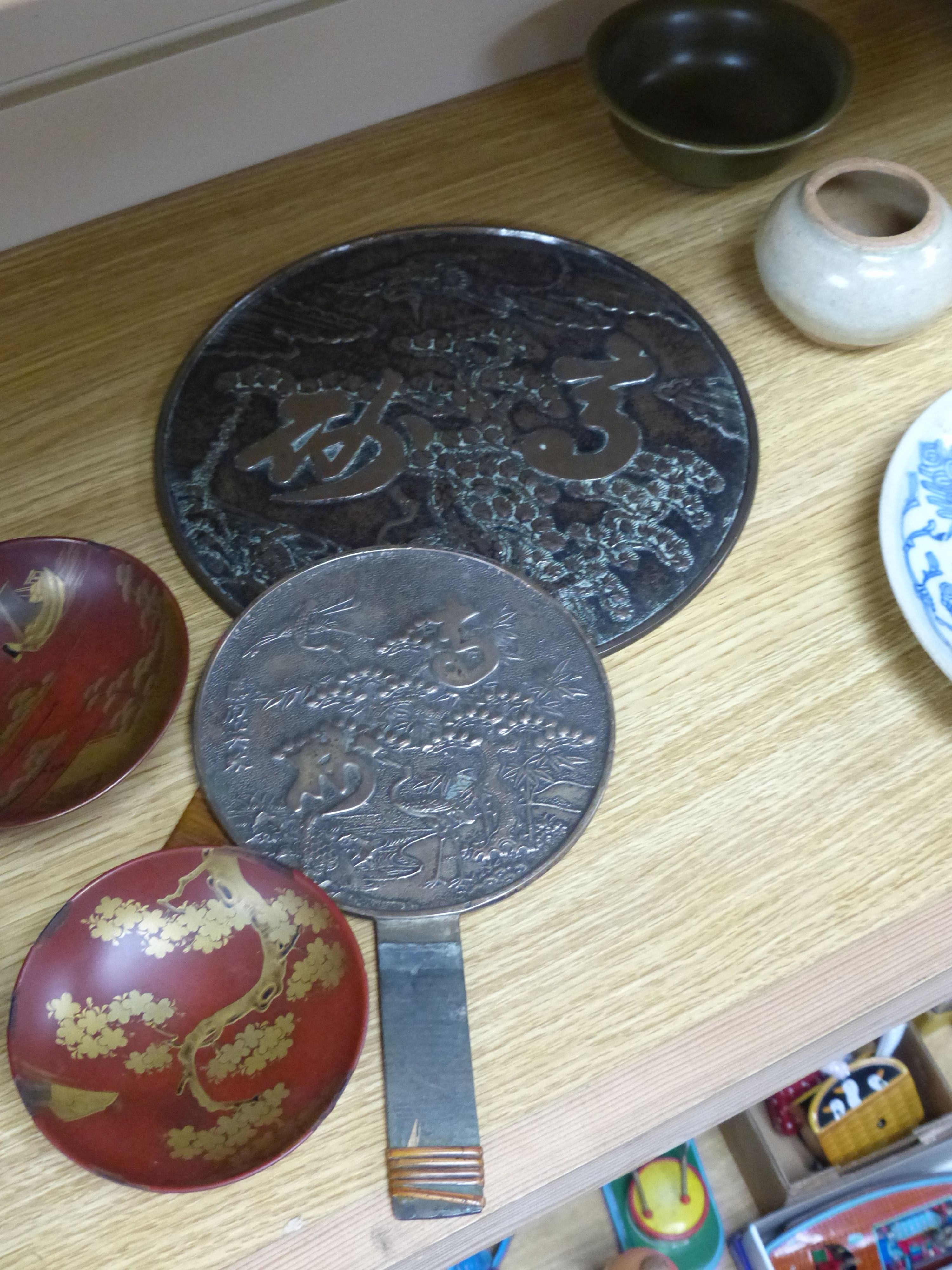 A Japanese lacquer makie three set of bowls and two mirrors, Edo to Meiji, tallest 32cm